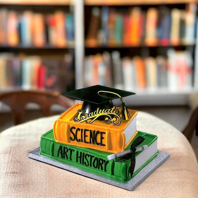 Graduation Hat on Stacked Books